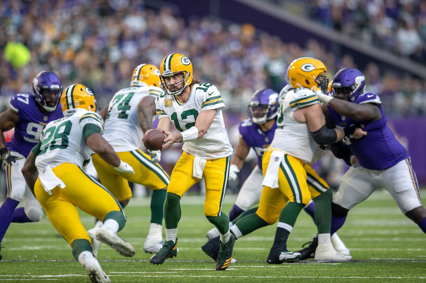 Packers quarterback Aaron Rodgers (12) passed the ball to Packers running back A.J. Dillon (28) during the third quarter, Sunday, Nov. 21, 2021 in Minneapolis, Minn. The Minnesota Vikings hosted the Green Bay Packers at U.S. Bank Stadium. ] ELIZABETH FLORES • liz.flores@startribune.com