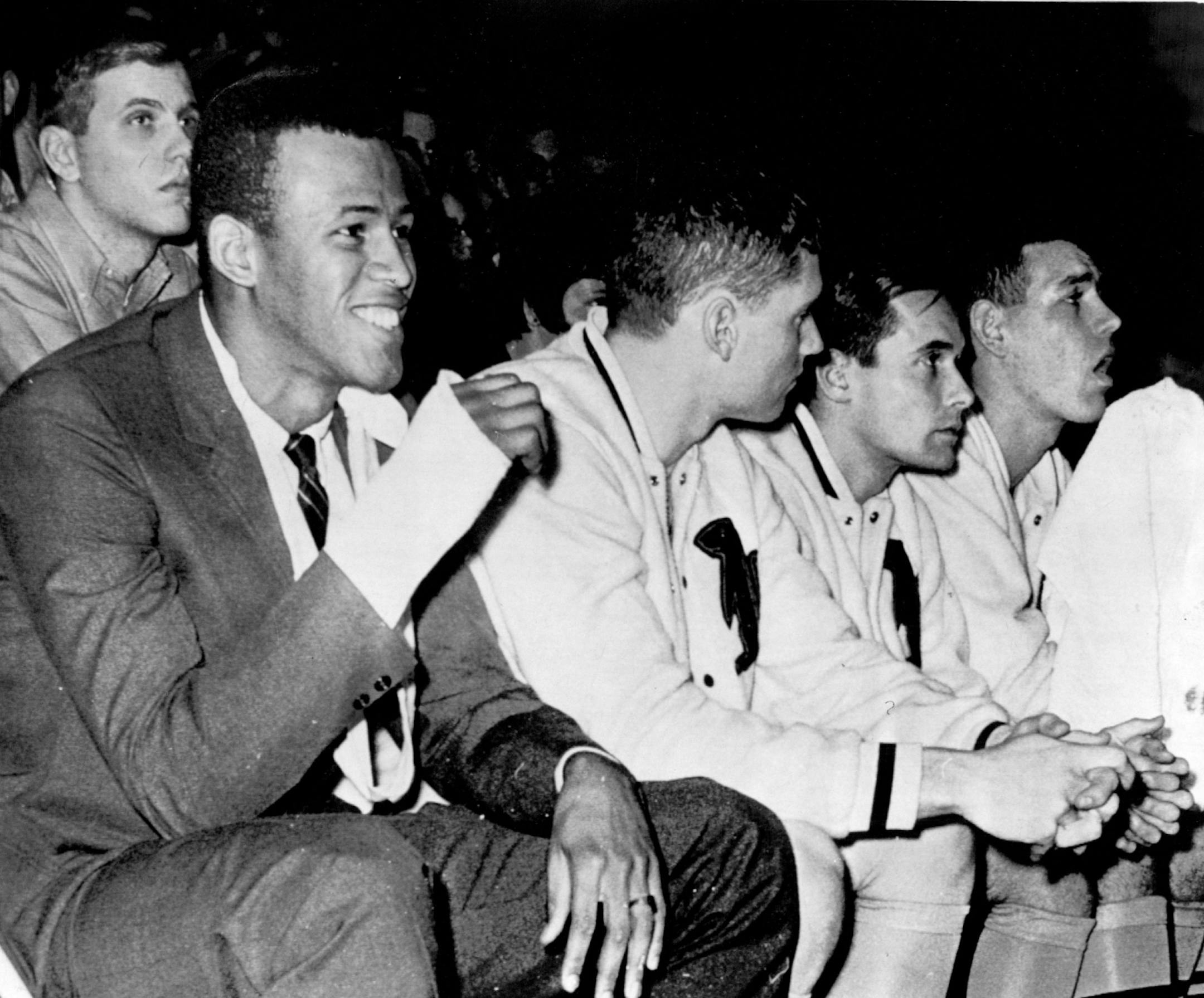 December 21, 1965 INJURED STAR LOU HUDSON WATCHES GOPHER TEAMMATES FROM THE BENCH Due to a broken bone in his wrist, he missed his first starting assignment in three season December 20, 1965 AP Wirephoto