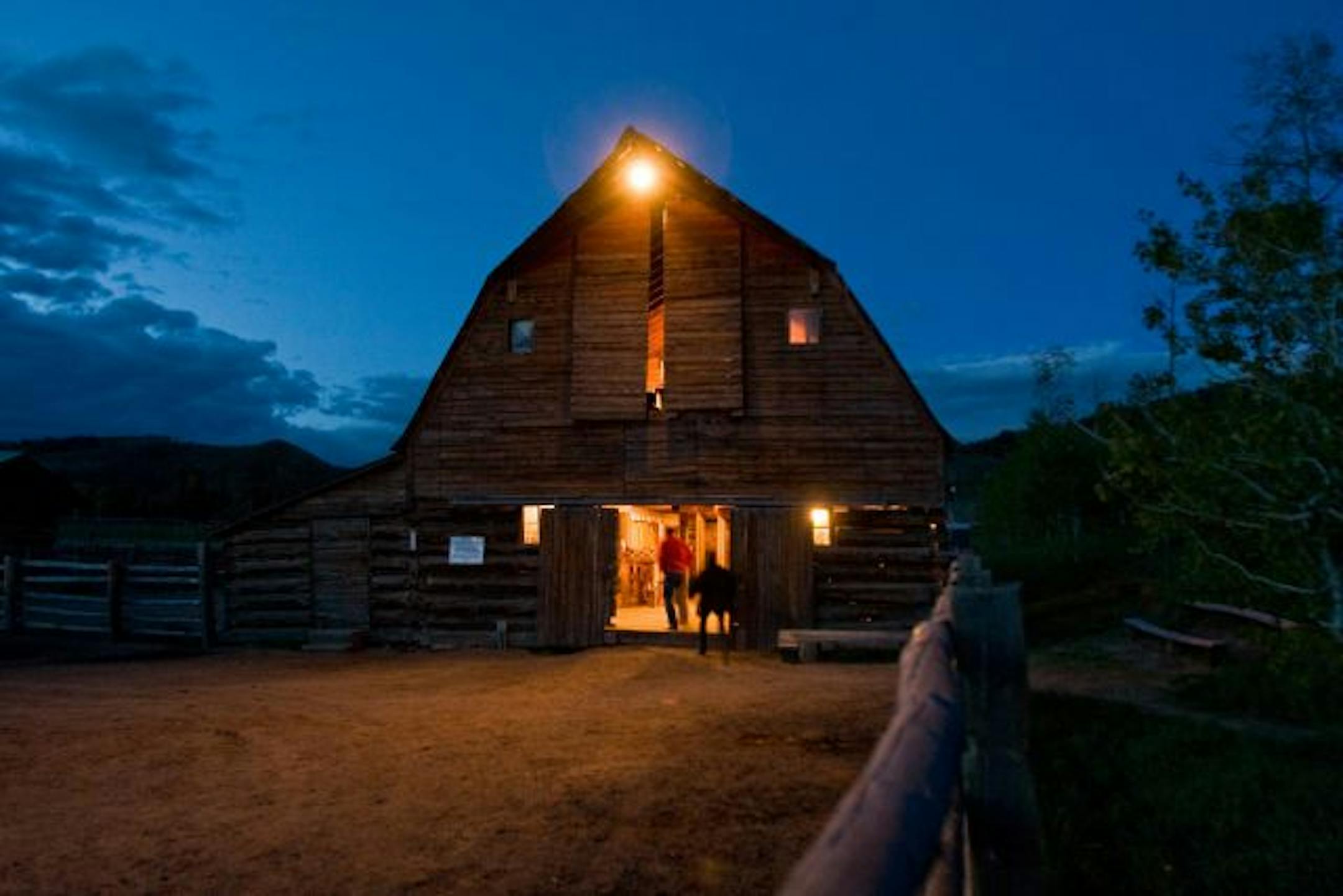 One of the barns at Home Ranch lit up for the weekly barn dance for guests and staff.