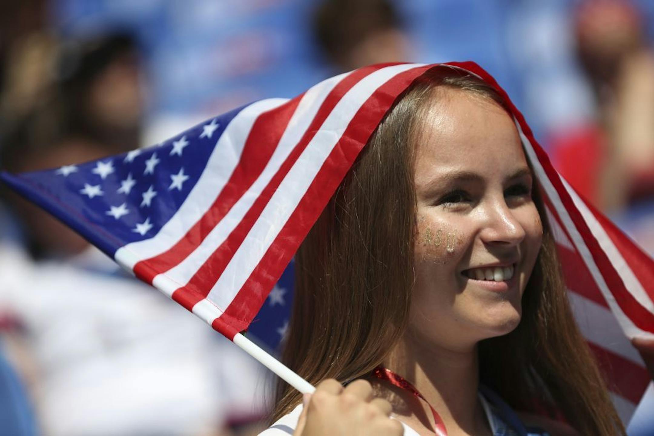 A United States fan waits for the start of the Women's World Cup final soccer match between US and The Netherlands at the Stade de Lyon in Decines, outside Lyon, France, Sunday, July 7, 2019.