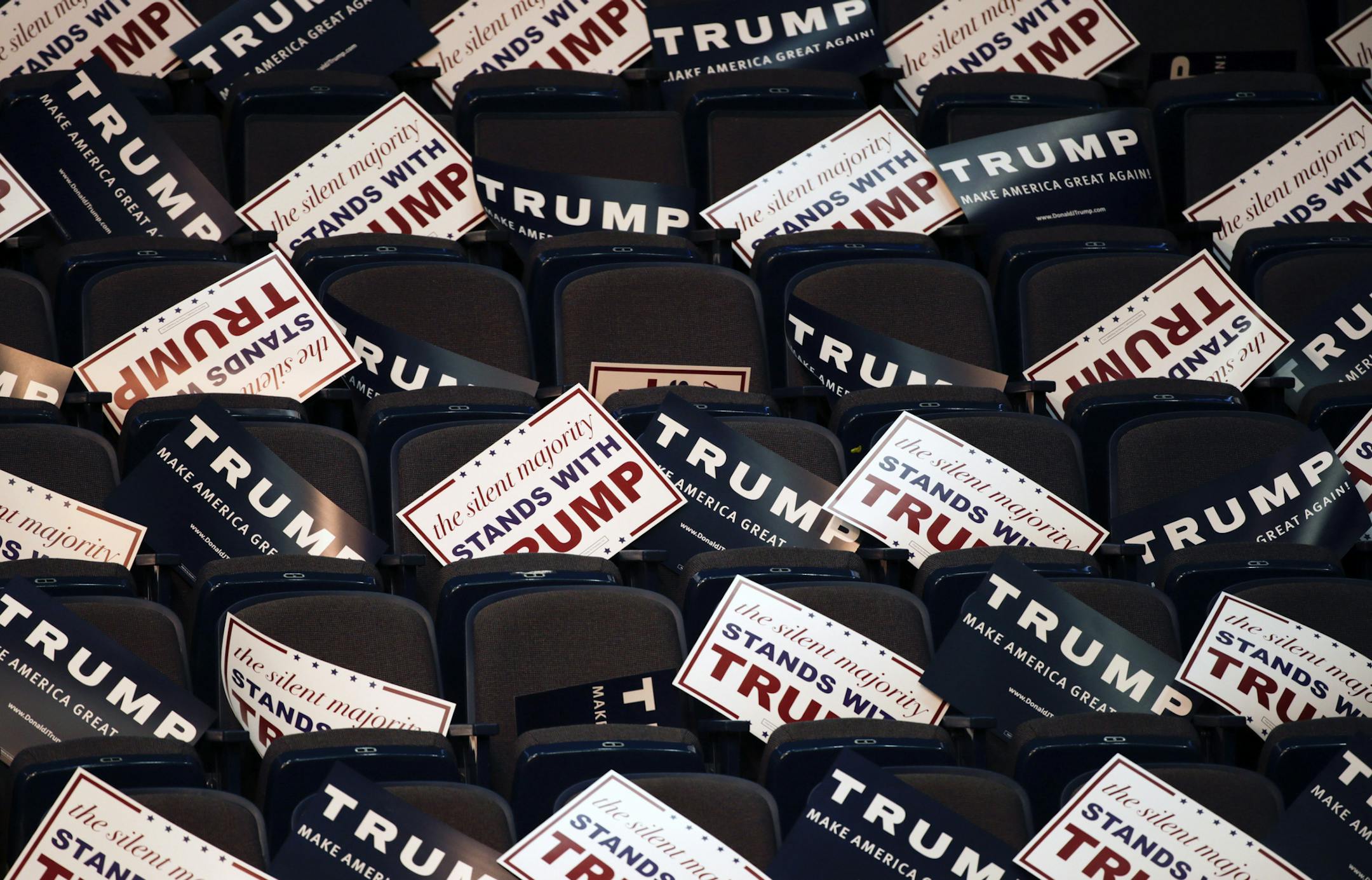 Campaign signs for Republican presidential candidate Donald Trump fill seats before a rally at the Times Union Center on Monday, April 11, 2016, in Albany, N.Y. (AP Photo/Mike Groll)