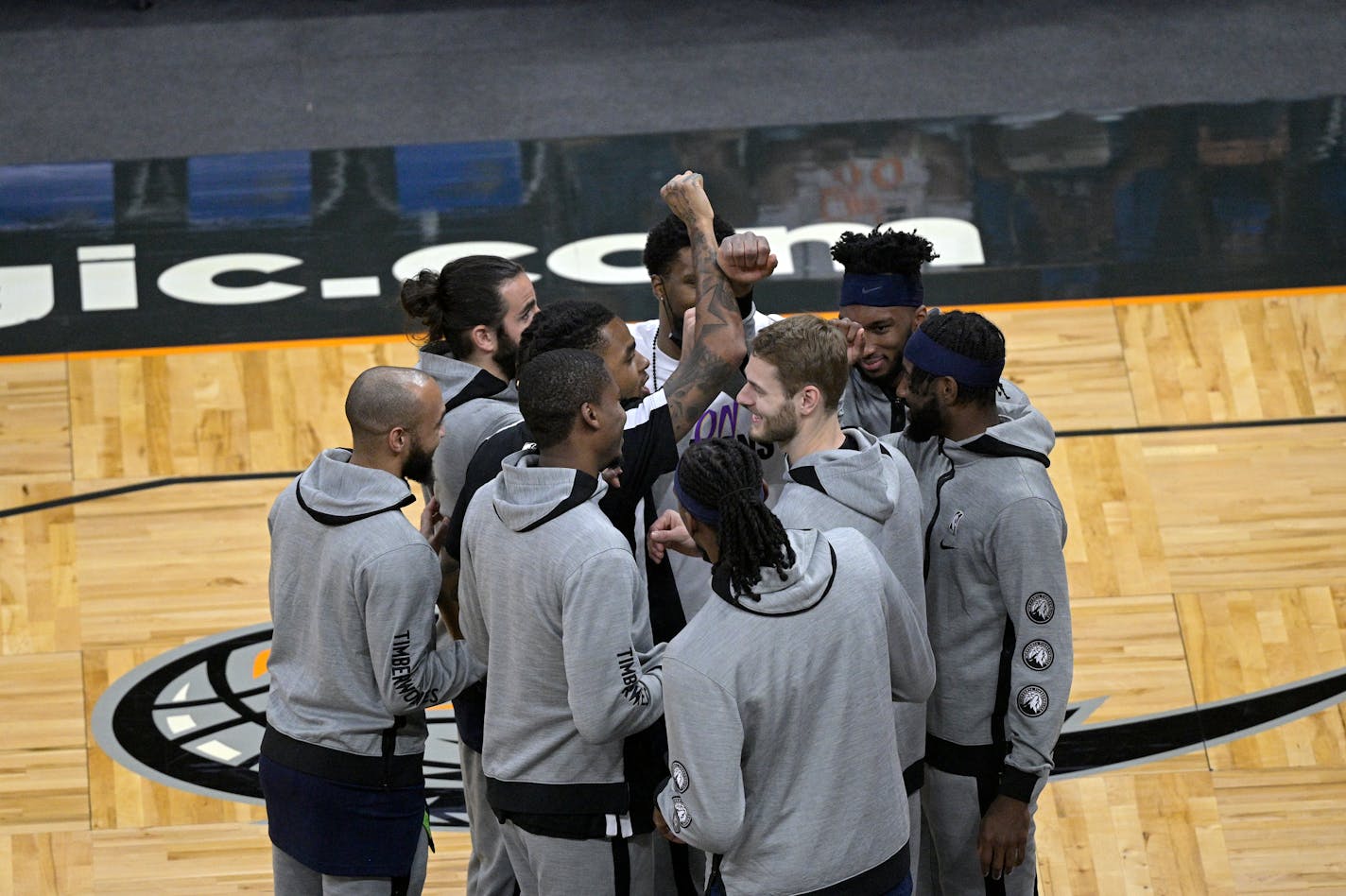 Minnesota Timberwolves players huddle on the court after player introductions before an NBA basketball game against the Orlando Magic, Sunday, May 9, 2021, in Orlando, Fla. (AP Photo/Phelan M. Ebenhack)