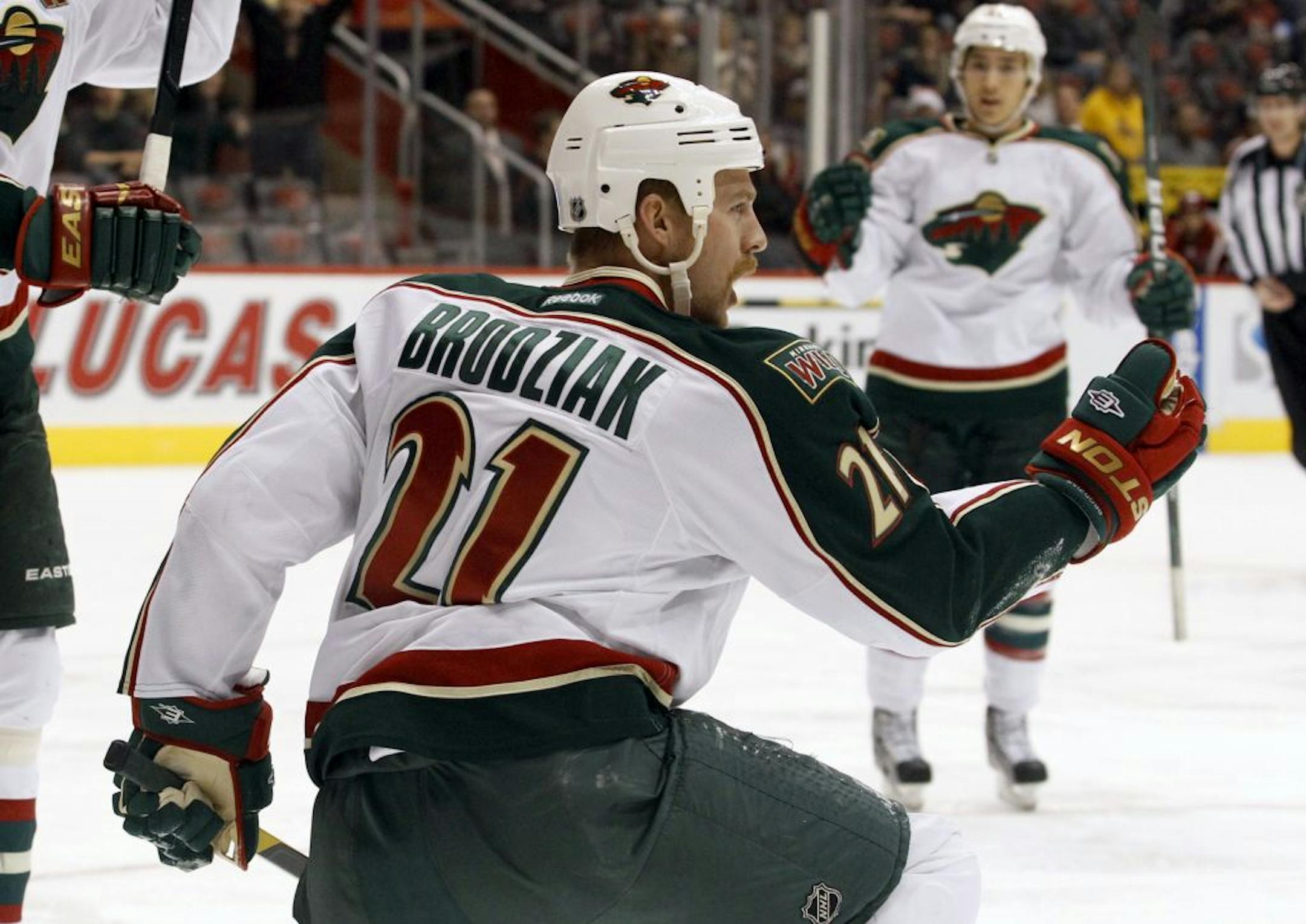Minnesota Wild center Kyle Brodziak celebrates his goal against the Phoenix Coyotes in the first period of an NHL hockey game, Saturday, Dec. 10, 2011, in Glendale, Ariz.