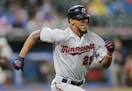 Minnesota Twins' Byron Buxton runs out a single after a bunt in the seventh inning of a baseball game against the Cleveland Indians, Friday, June 23, 