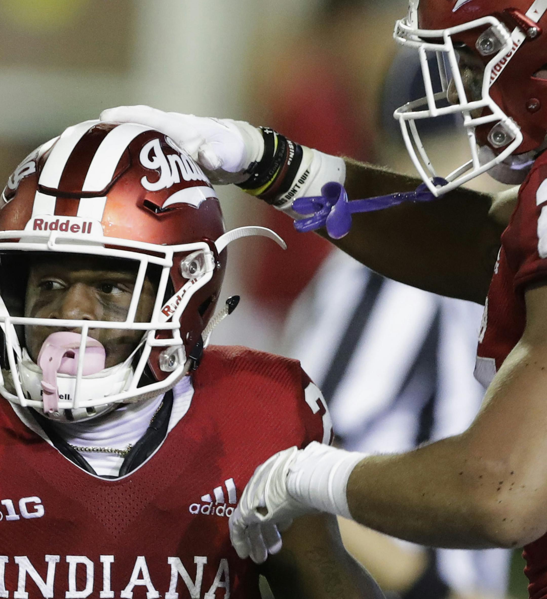 Indiana's Whop Philyor (22) celebrates with Mike Majette after Philyor scored a touchdown during the second half of an NCAA college football game against Michigan State, Saturday, Sept. 22, 2018, in Bloomington, Ind. Michigan State won 35-21. (AP Photo/Darron Cummings) ORG XMIT: INDC118