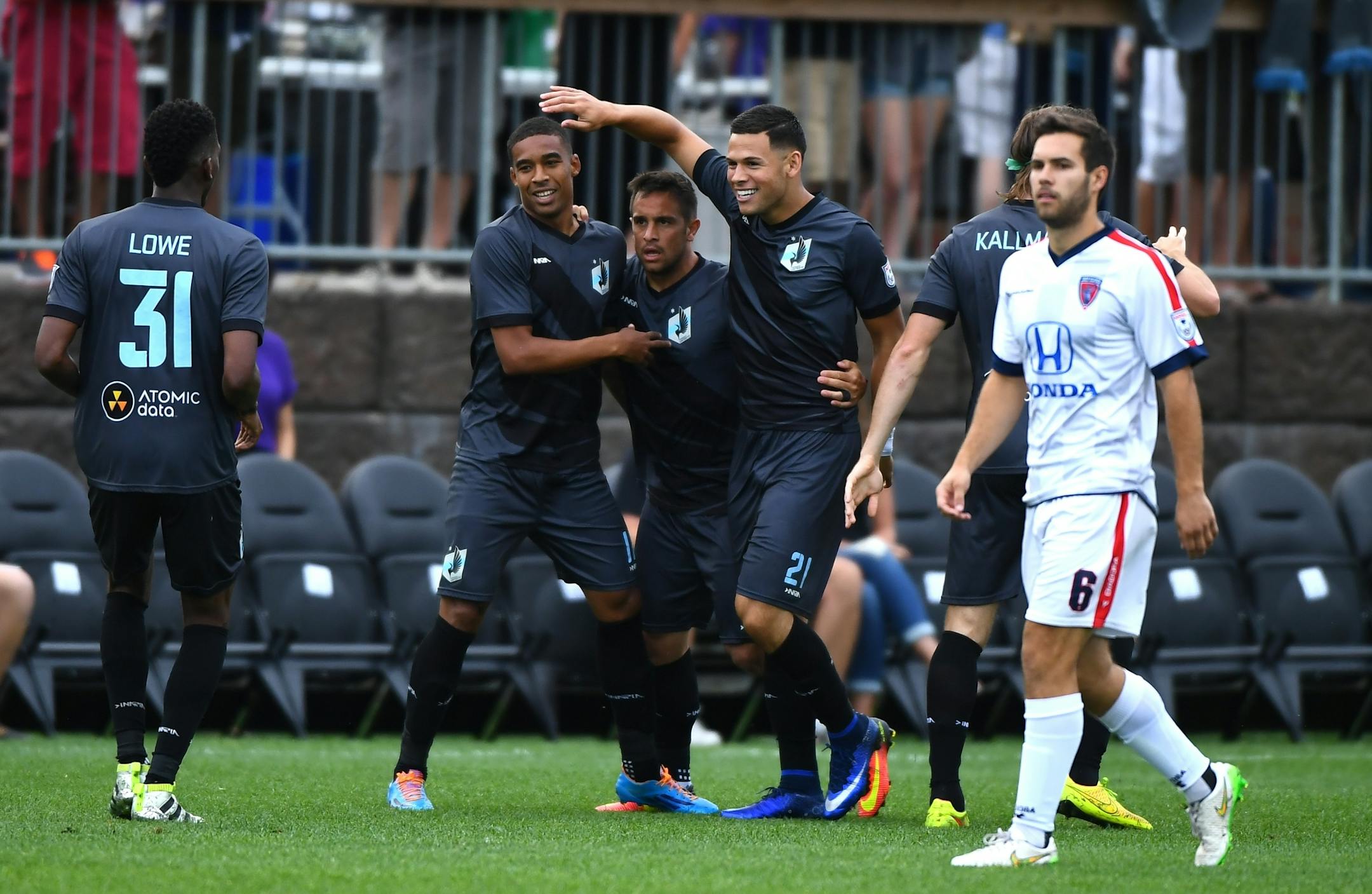 Teammates celebrated with Minnesota United FC forward Christian Ramirez (21) after he scored his second goal against the Indy Eleven early in the first half Saturday.