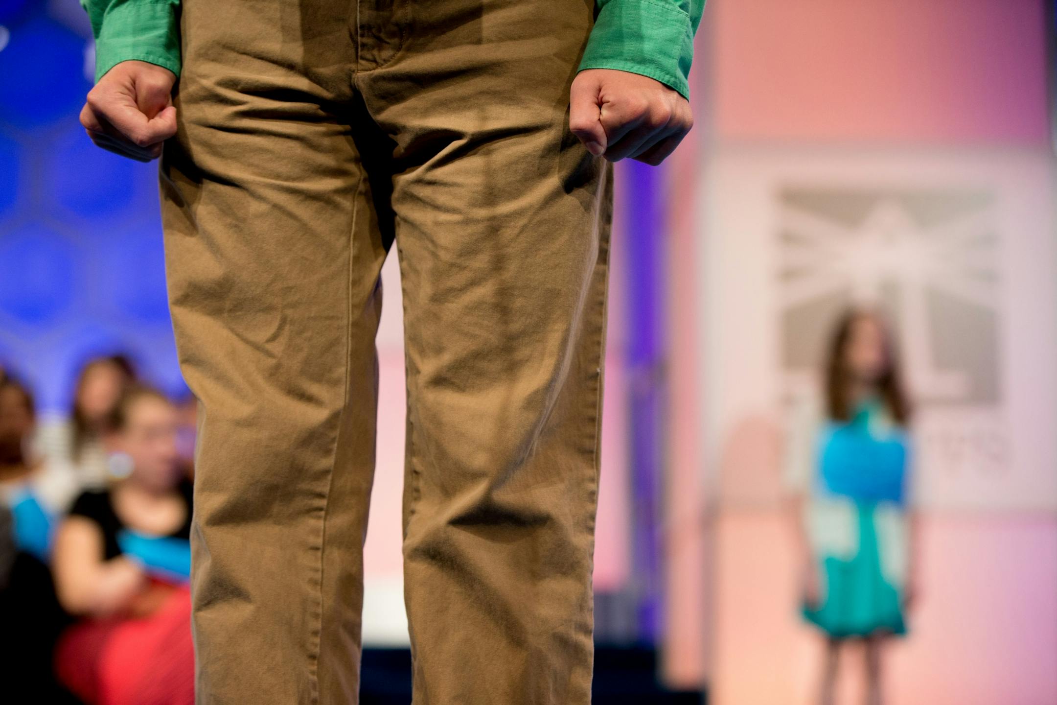 Bates Bennett, 14, of Memphis, Tenn. clenches his fists as he correctly spells the word "bowery" during 2015 Scripps National Spelling Bee, Wednesday, May 27, 2015, in Oxon Hill, Md.