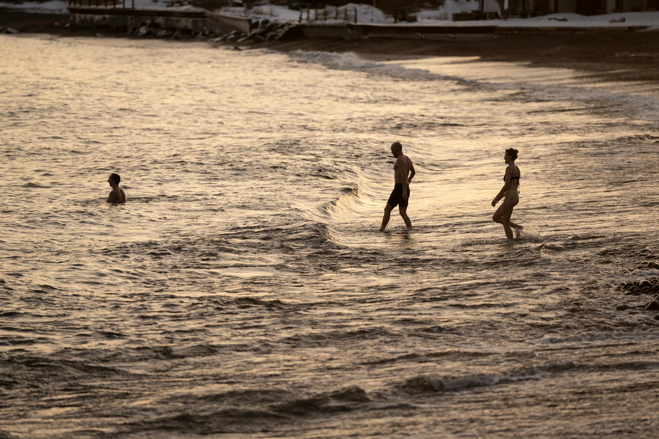 Sauna guests take a walk to Lake Superior after sitting in a hot sauna at Sisu and Löyly Sauna.