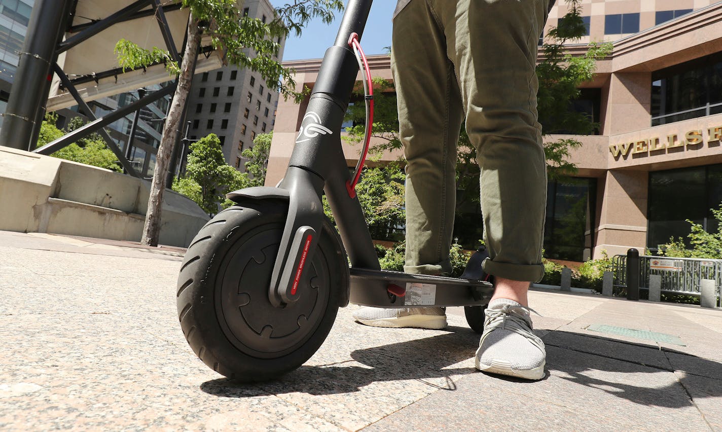 A person rides an electric scooter