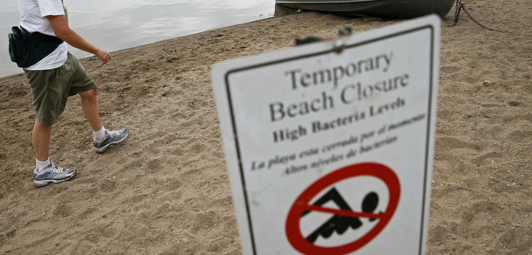 At a 32nd St. swimming beach on Lake Calhoun, the waters are off limits to swimmers due to the high bacteria count. Claudia McMullen does not swim here but this will not deter her from swimmming in Cedar Lake and Lake Harriet.] tsong-taataarii@startribune.com