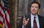 FBI Director James Comey discusses race and law enforcement, Thursday, Feb. 12, 2015, at Georgetown University in Washington. Comey said the nation is