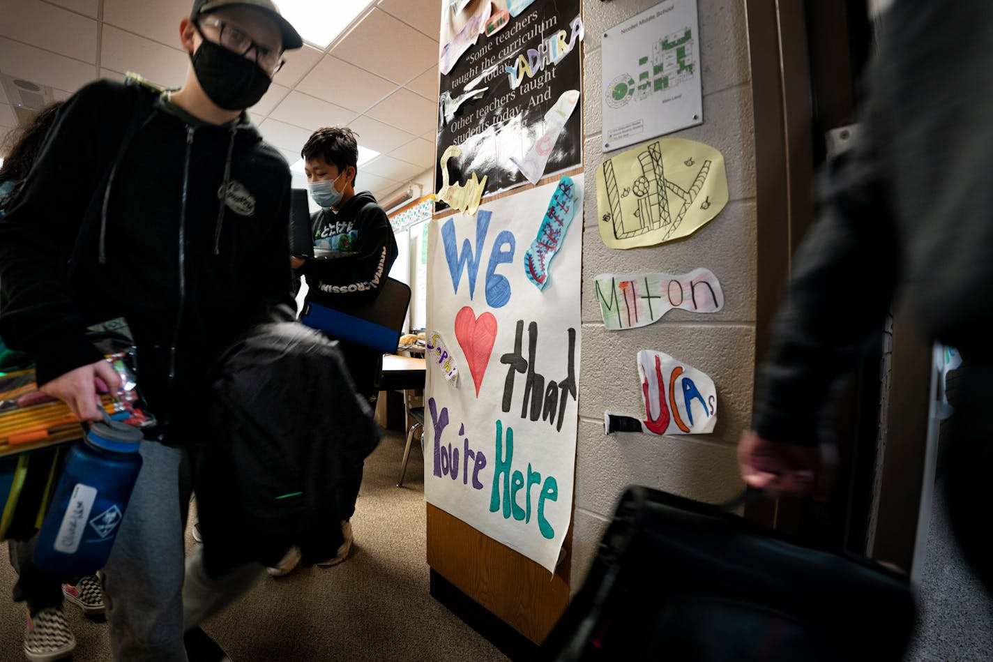 We Love That You're Here. A handmade sign greets students as they come and go from Bounthavy Khamratthanome's 6th grade science and social studies room Thursday, Nov. 4, 2021, Nicollet Middle School, Burnsville, Minn. ] GLEN STUBBE • glen.stubbe@startribune.com