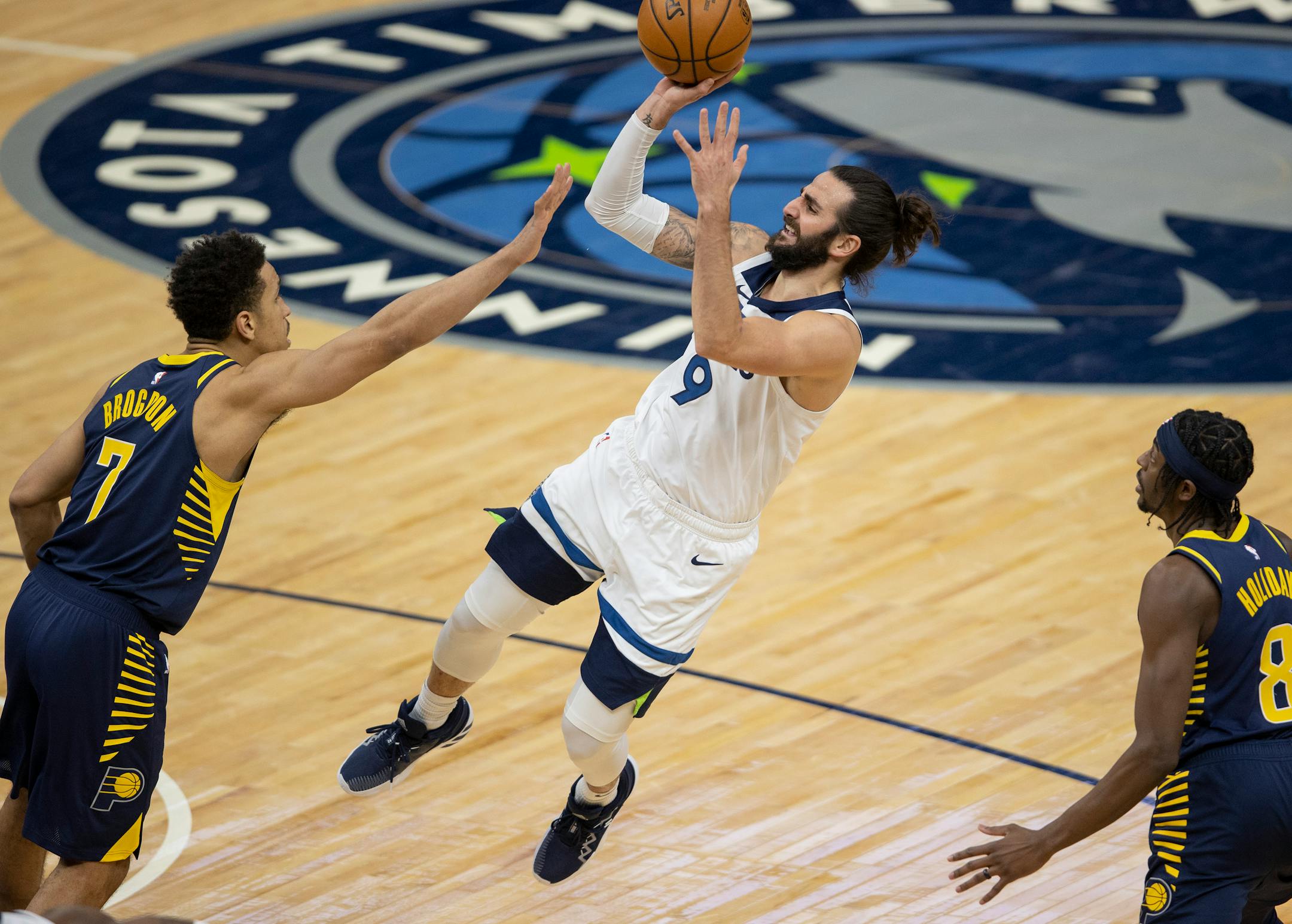 Minnesota Timberwolves Ricky Rubio (9) was defended by Malcolm Brogdon (7) of the Indiana Pacers in the third quarter.