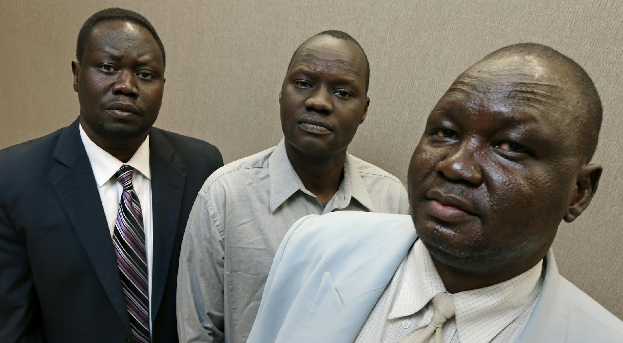 (left to right) Gojjan Tutlam, Chair of the Sudanese Community, Steven Nyag Wang, political activist and Lul Gatkuoth Gatluak, political activist will be at the ralley at the state capital in St. Paul, to educated Minnesotan's about the current crisis in South Sudan. Several hundred members of the Sudanese community are expected to attend the event. As the newly formed country of South Sudan teeters on the brink of civil war, members of two tribes represented there - the Nuer and the Dinka - are