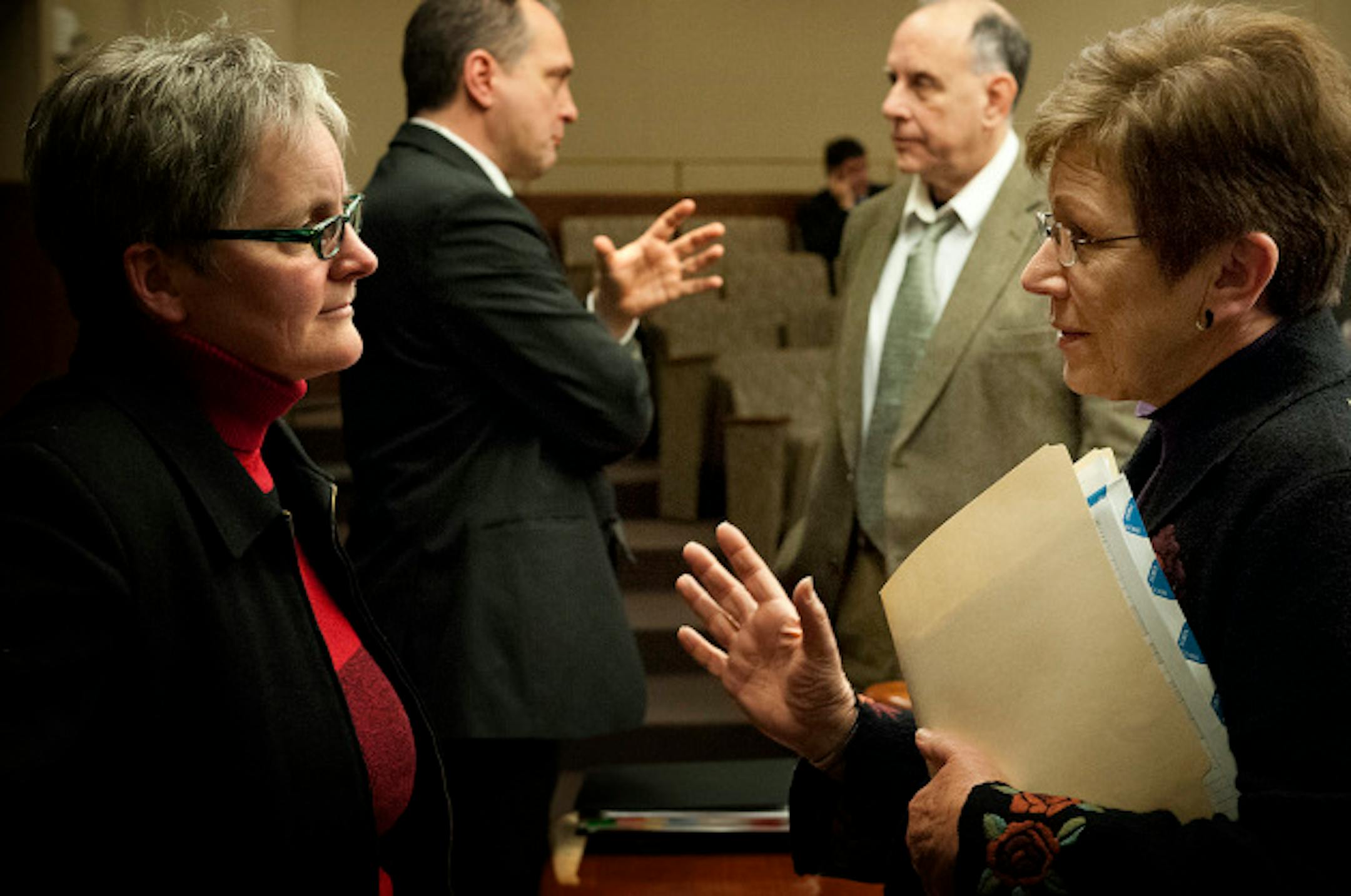State Budget Director Margaret Kelly  and Minnesota Management and Budget Commissioner Jim Schowalter, left talked with legislators Joe Mullery (DFL)  and  Alice Hausman (DFL) , after the hearing where they testified before the House Ways and Means committee Monday, January 28, 2013 on Governor Dayton's budget.     ]   GLEN STUBBE * gstubbe@startribune.com