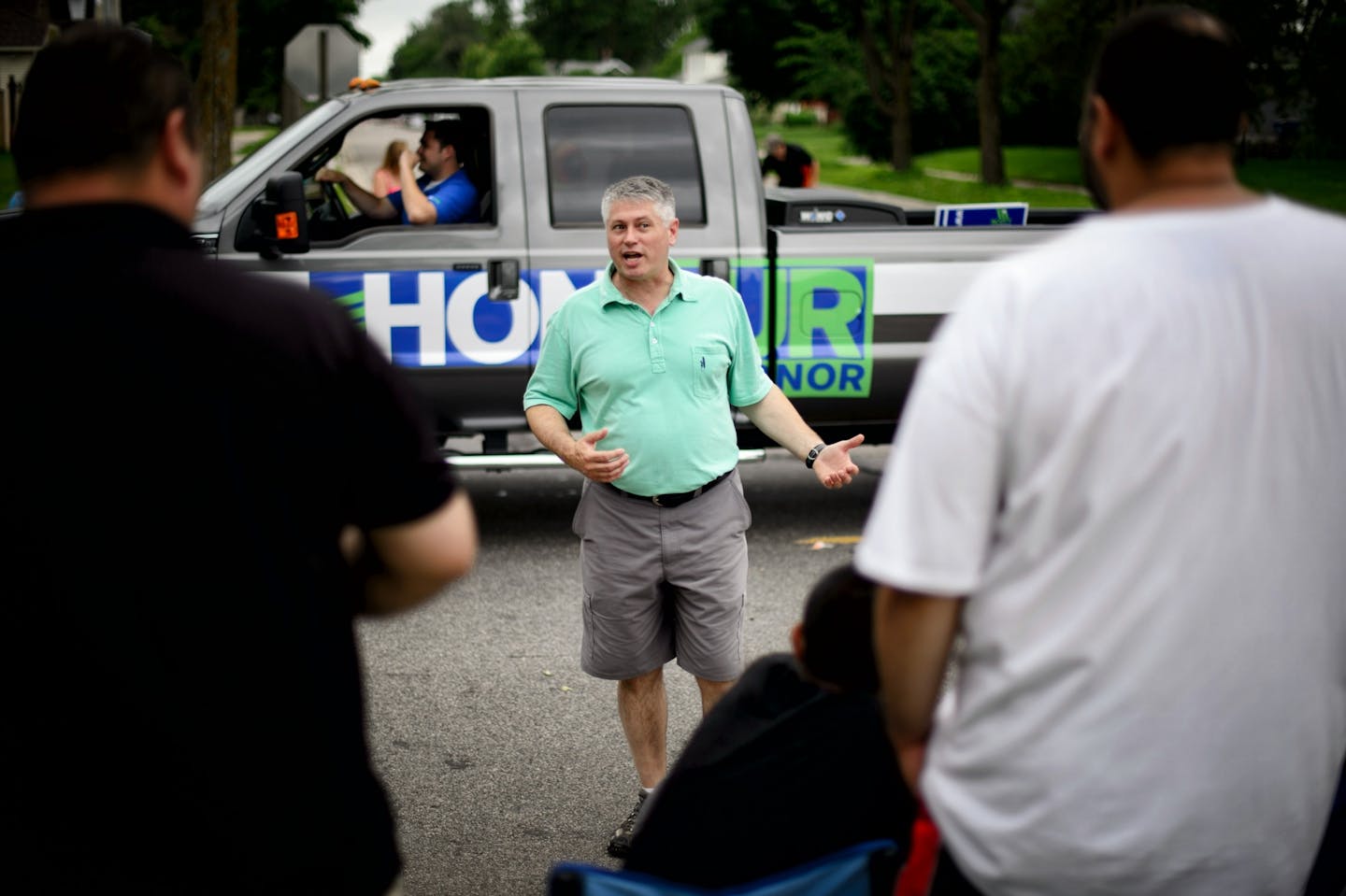 Scott Honour, one of four serious contenders in the GOP primary for governor, greeted people along the parade route at the Granite City Days parade in St. Cloud, June 28, 2014.