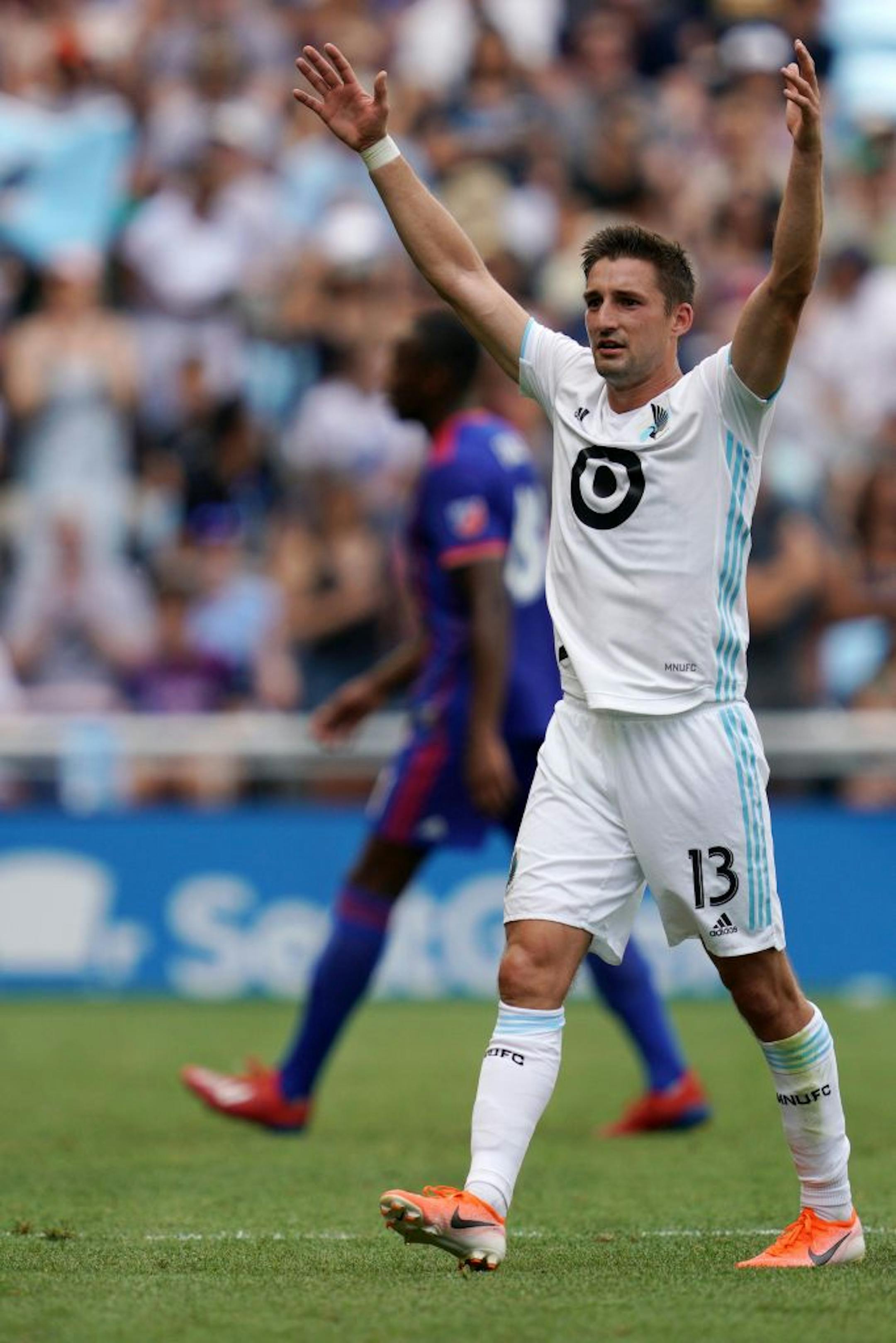 Minnesota United midfielder Ethan Finlay (13) celebrated after scoring a goal in the first half.
