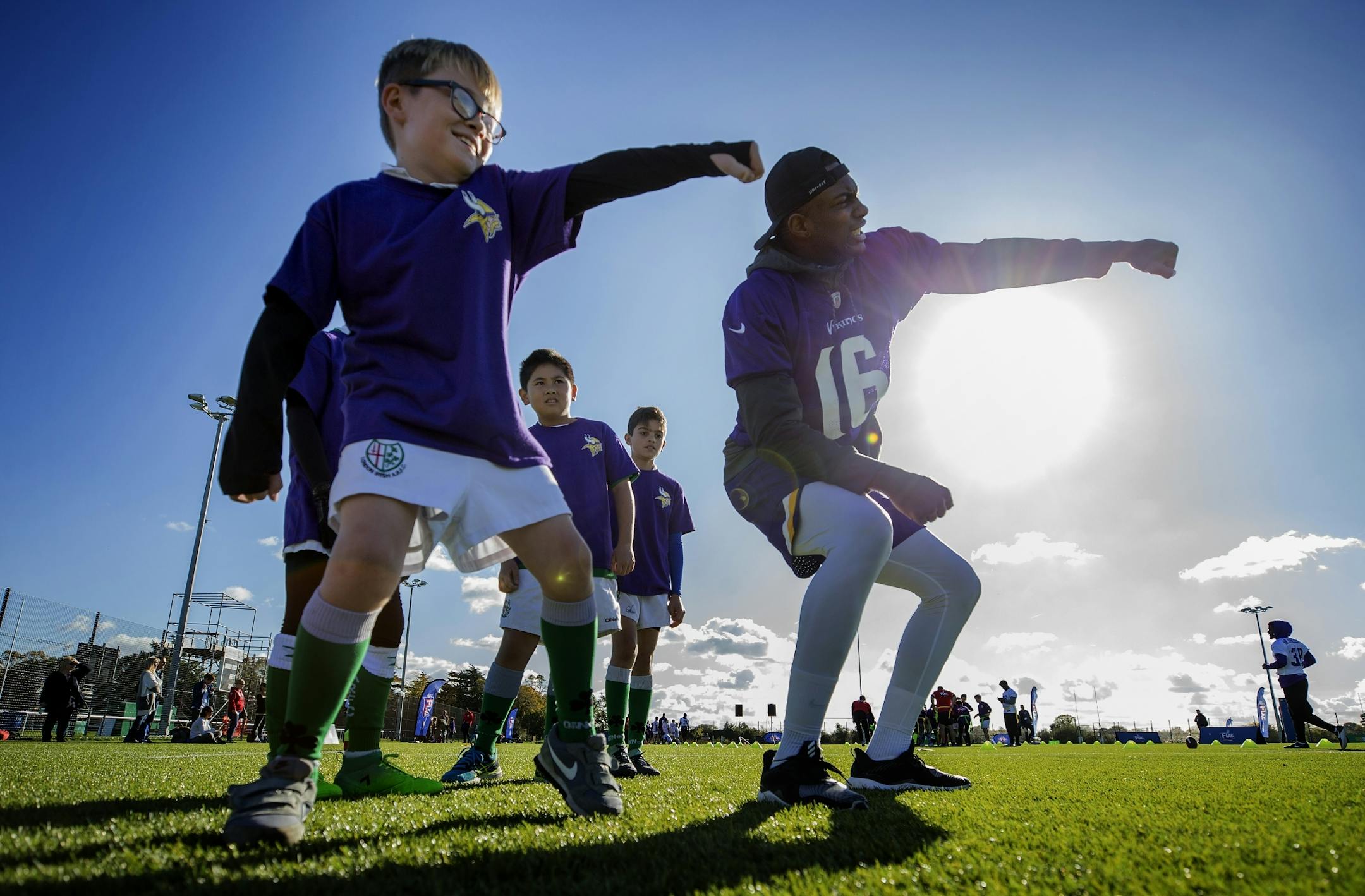 Leon Morozgalski-Blackman, 9, and Cayleb Jones (16) danced to Watch Me (Whip/Nae Nae) by Silento during an NFL FLAG event after Minnesota Vikings practice at the London Irish Training Ground.