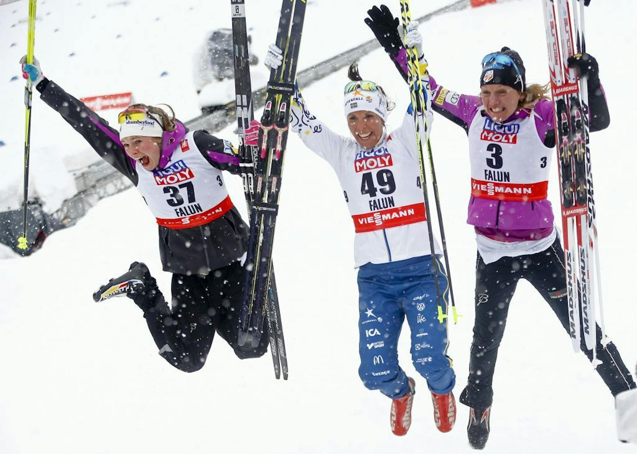 Winner Sweden's Charlotte Kalla, center, celebrates besides second placed United States' Jessica Diggins, left, and third placed United States' Caitlin Gregg after the 10 km Individual competition at the Nordic Skiing World Championships in Falun, Sweden, Tuesday, Feb. 24, 2015.