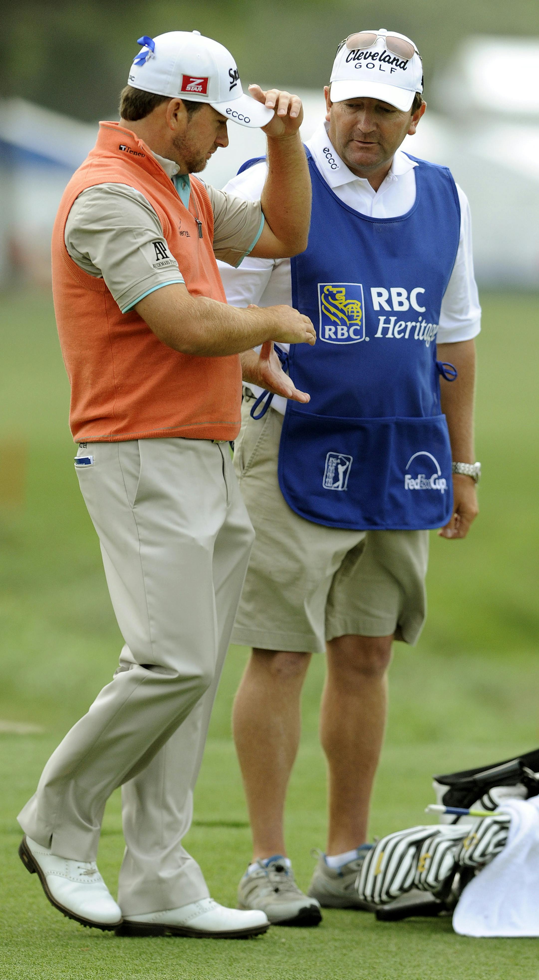 Graeme McDowell, of Northern Ireland, is congratulated by his caddie Ken Comboy during the final round of the Heritage golf tournament in Hilton Head, S.C., Sunday, April 21, 2013. McDowell beat Webb Simpson in a playoff. (AP Photo/Stephen Morton)