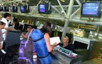 FILE - In this Aug. 11, 2006 file photo, passengers en route to London check in at Biarritz airport, southwestern France, The U.S. is expected to broa