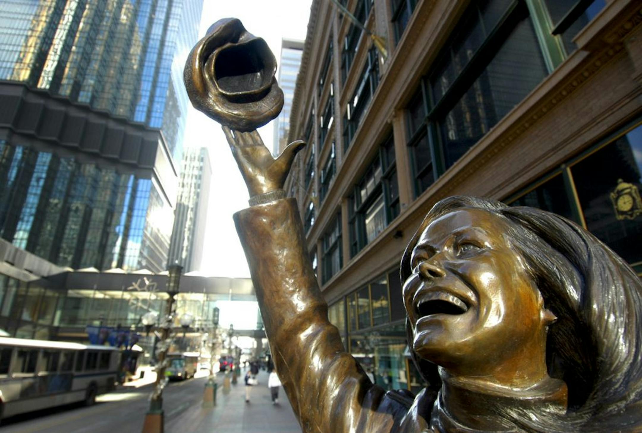 A statue of actress Mary Tyler Moore stands at the corner on Nicollet Mall