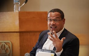 Minnesota Attorney General Keith Ellison listened to attendees introduce themselves and describe incidents in the school district that motivated them 