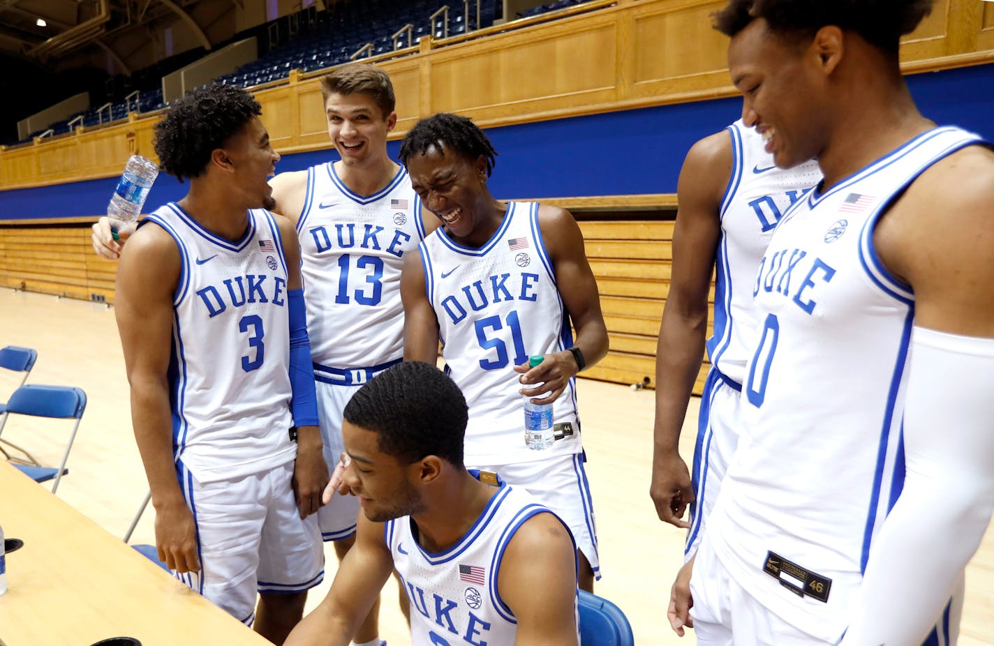 Duke's Tre Jones (3) laughs with Joey Baker (13), Mike Buckmire (51), Cassius Stanley (2), and Wendell Moore (0) during media day at Cameron Indoor Stadium in Durham, N.C.