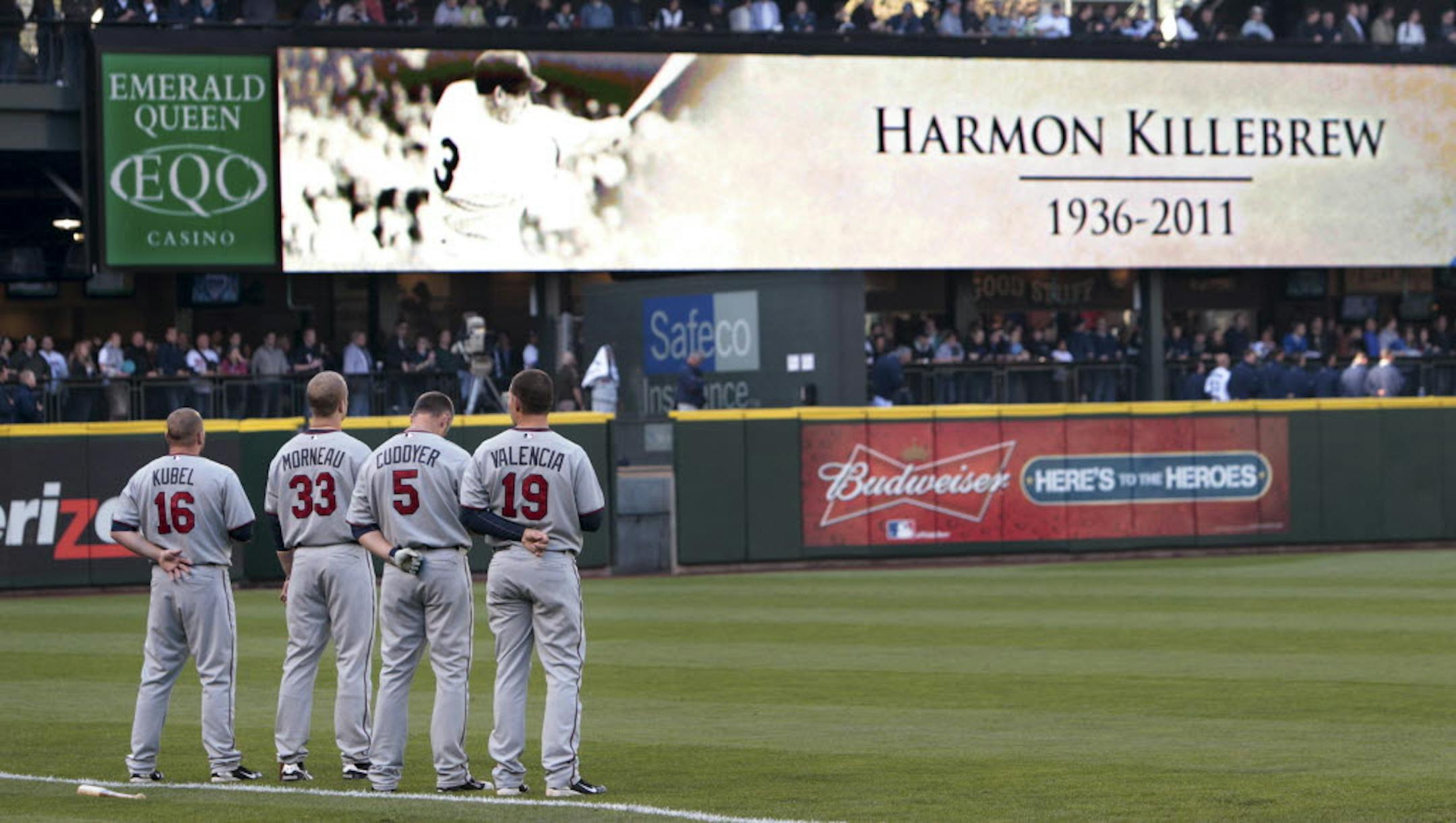 Twins players stand along the third-base line during a moment of silence to honor Hall of Famer Harmon Killebrew before Tuesday's game against the Seattle Mariners.