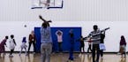 Children from a local school use the gym during physical education at the Brian Coyle Center on Monday, October 24, 2016, in Minneapolis, Minn. ] RENE