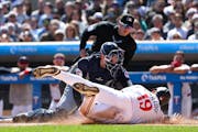 Cleveland catcher David Fry tags out the Twins' Alex Kirilloff at home plate during the first inning Saturday at Target Field.