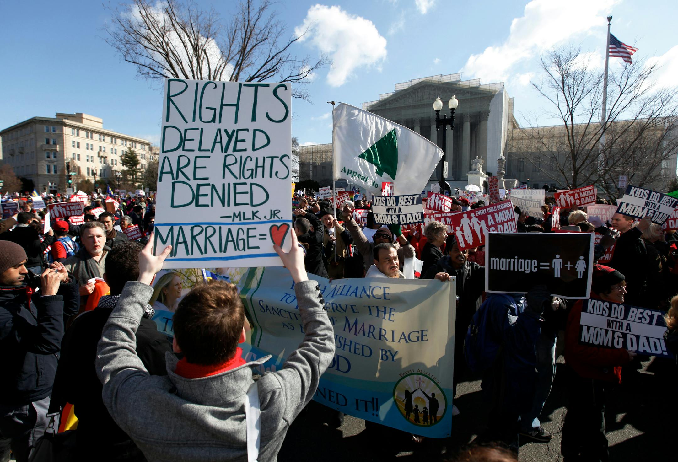 Demonstrators gather as arguments are heard on California's Proposition 8 concerning gay marriage, outside the U.S. Supreme Court in Washington, D.C., Tuesday.