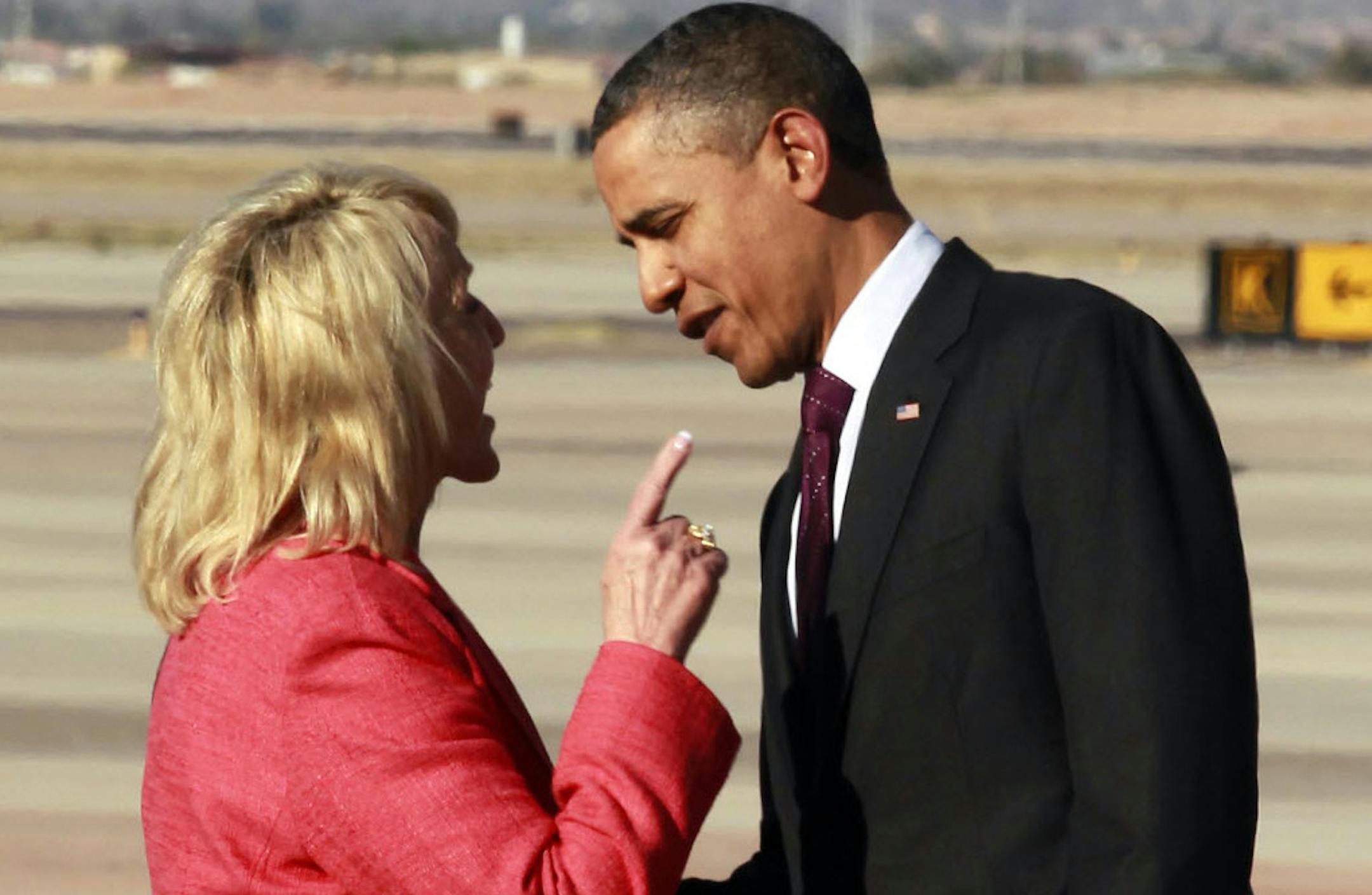 Jan. 25, 2012: Arizona Gov. Jan Brewer points during an intense conversation with President Barack Obama at Phoenix-Mesa Gateway Airport.