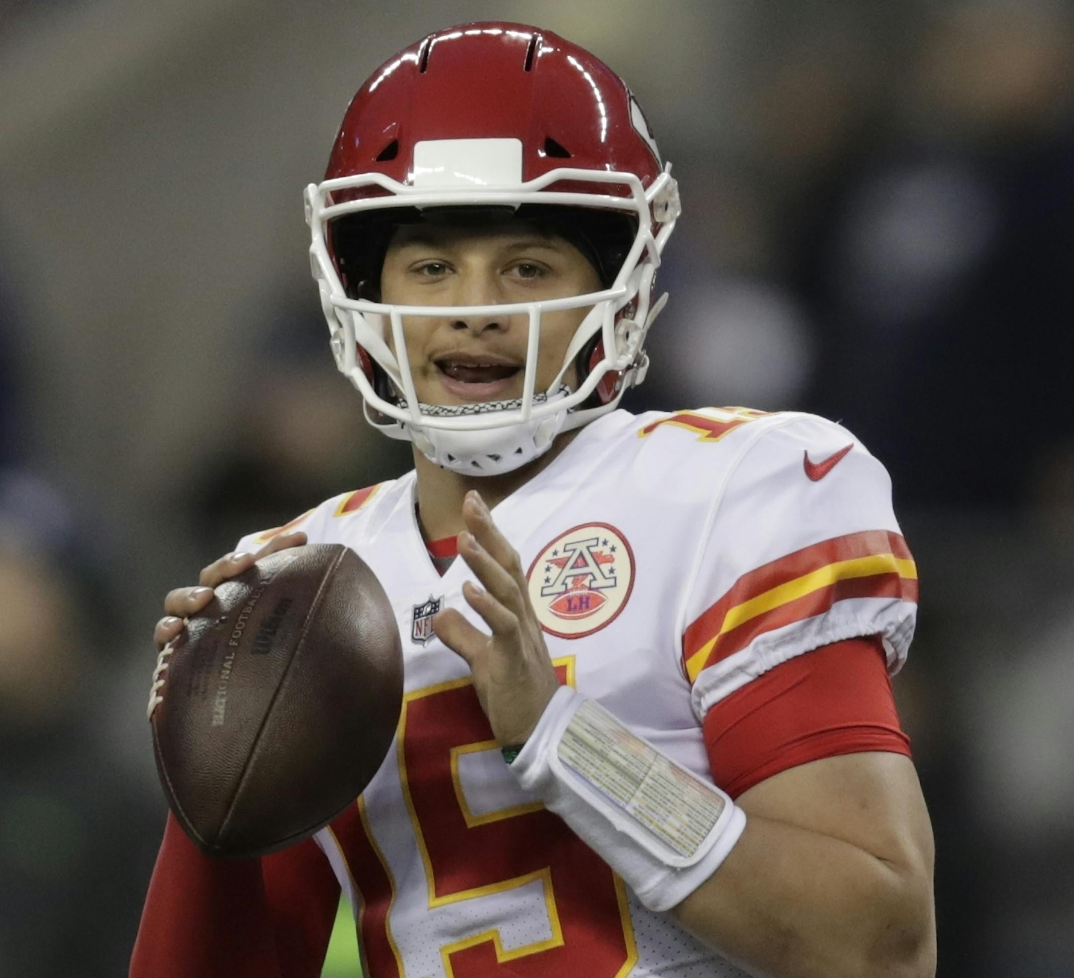 Kansas City Chiefs quarterback Patrick Mahomes passes during warmups before an NFL football game against the Seattle Seahawks, Sunday, Dec. 23, 2018, in Seattle. (AP Photo/Stephen Brashear)