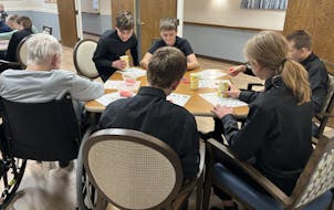 Their performance complete, eighth-grade string students from Owatonna Middle School talked to the residents of the TImberdale Trace assisted-living c