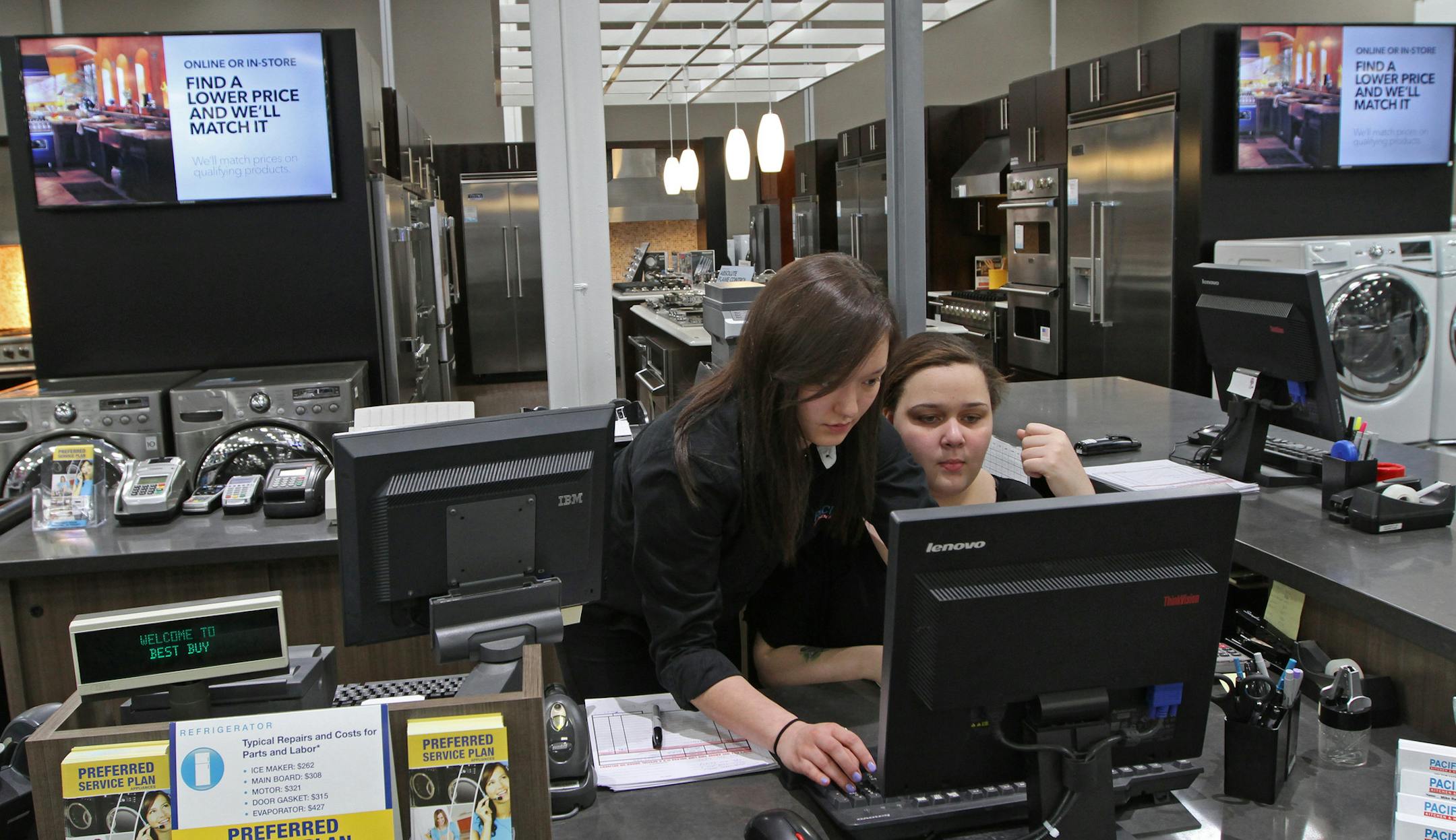 (left to right) Pacific Kitchen Customer Service Specialists Leah Dahlberg and Shayla Sweats worked near high end appliances that were on display at the Best Buy Pacific Kitchen display at the Richfield MN., store on 3/6/13. Best Buy's appliance business has shown strong growth, one of the few product categories where comp sales have increased. At the company's next generation Connected Store, Best Buy has devoted quite a bit of space to its high end Pacific Kitchen brand.] Bruce Bisping/Star Tr