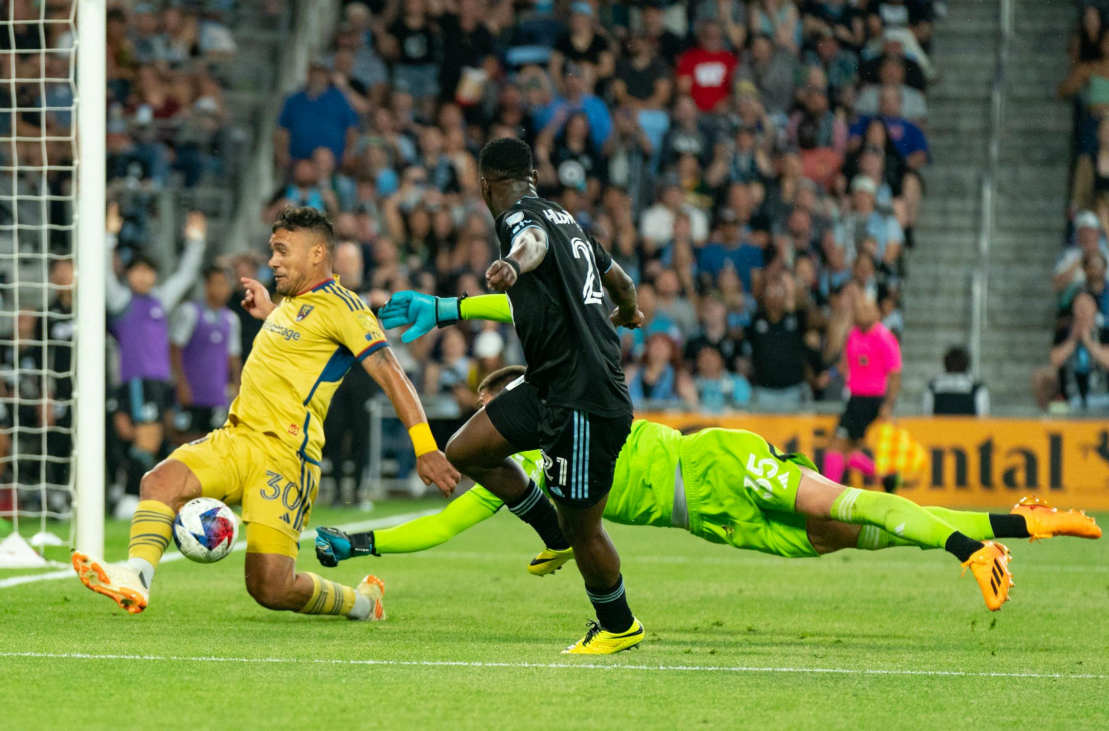Real Salt Lake defender Marcelo Silva (30) blocks a shot attempt by Minnesota United forward Bongokuhle Hlongwane (21) as Real Salt Lake goalkeeper Gavin Beavers (35) dives for the ball in the second half.