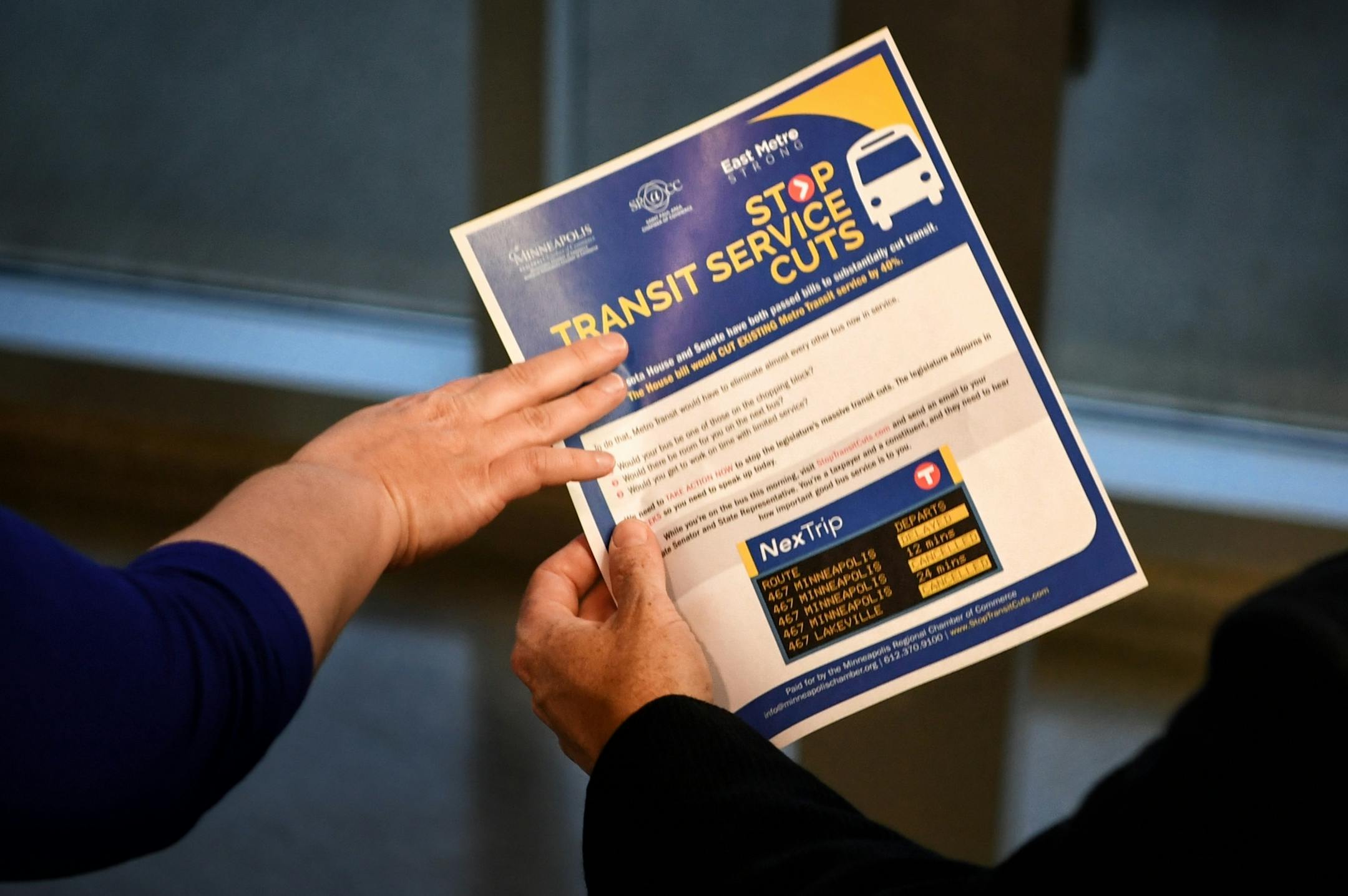 Members of the Minneapolis and St. Paul chambers of commerce offered leaflets to morning commuters at Kenrick Avenue Park-n-Ride in Lakeville, urging them to call their legislators about a proposed 40 percent reduction in transit funding.