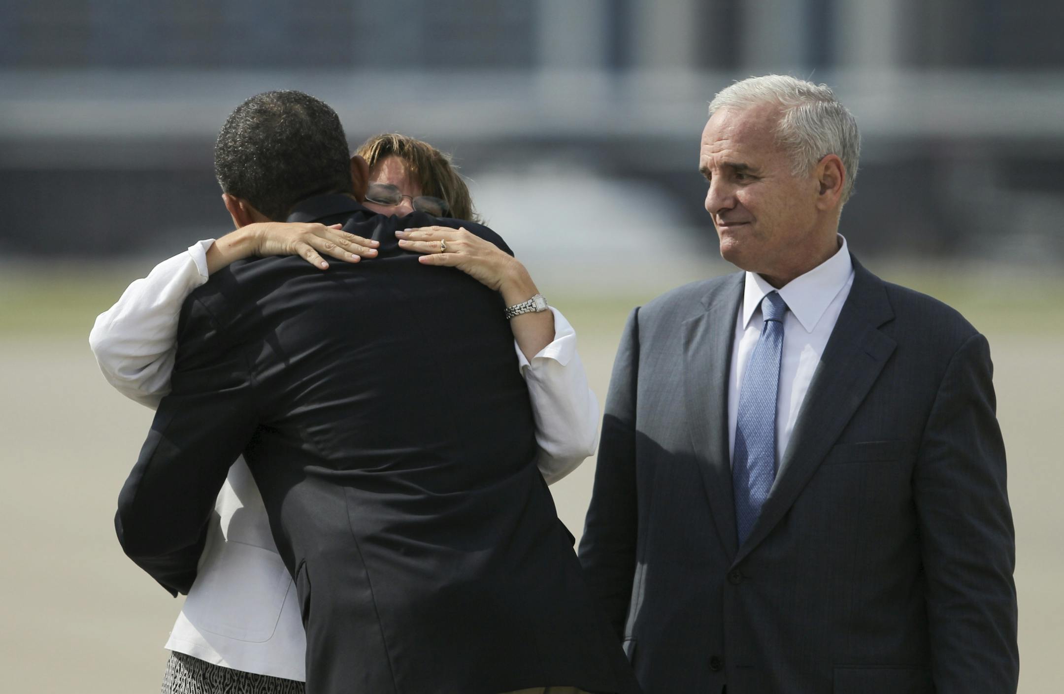 President Barack Obama was welcomed by Sen. Amy Klobuchar while Minnesota Gov. Mark Dayton stood at right after he arrived on Air Force One in 2011.