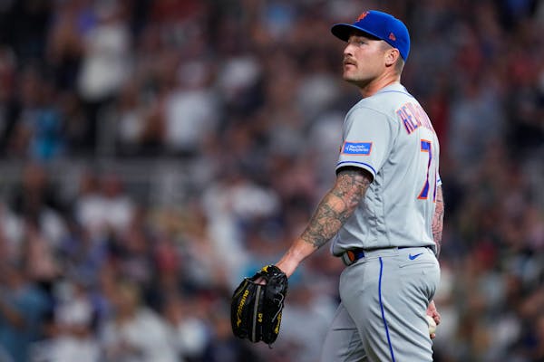 Mets relief pitcher Sean Reid-Foley reacted after the Twins’ Andrew Stevenson scored off a throwing error by catcher Francisco Alvarez during the se