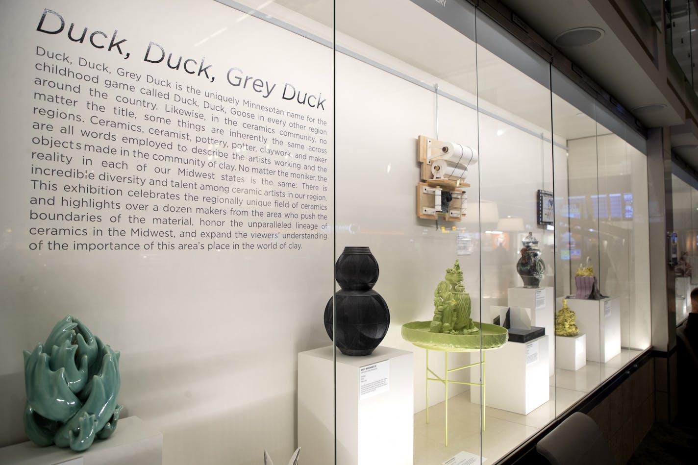 A glass case displayed ceramics from the "Duck, Duck, Grey Duck" exhibit.