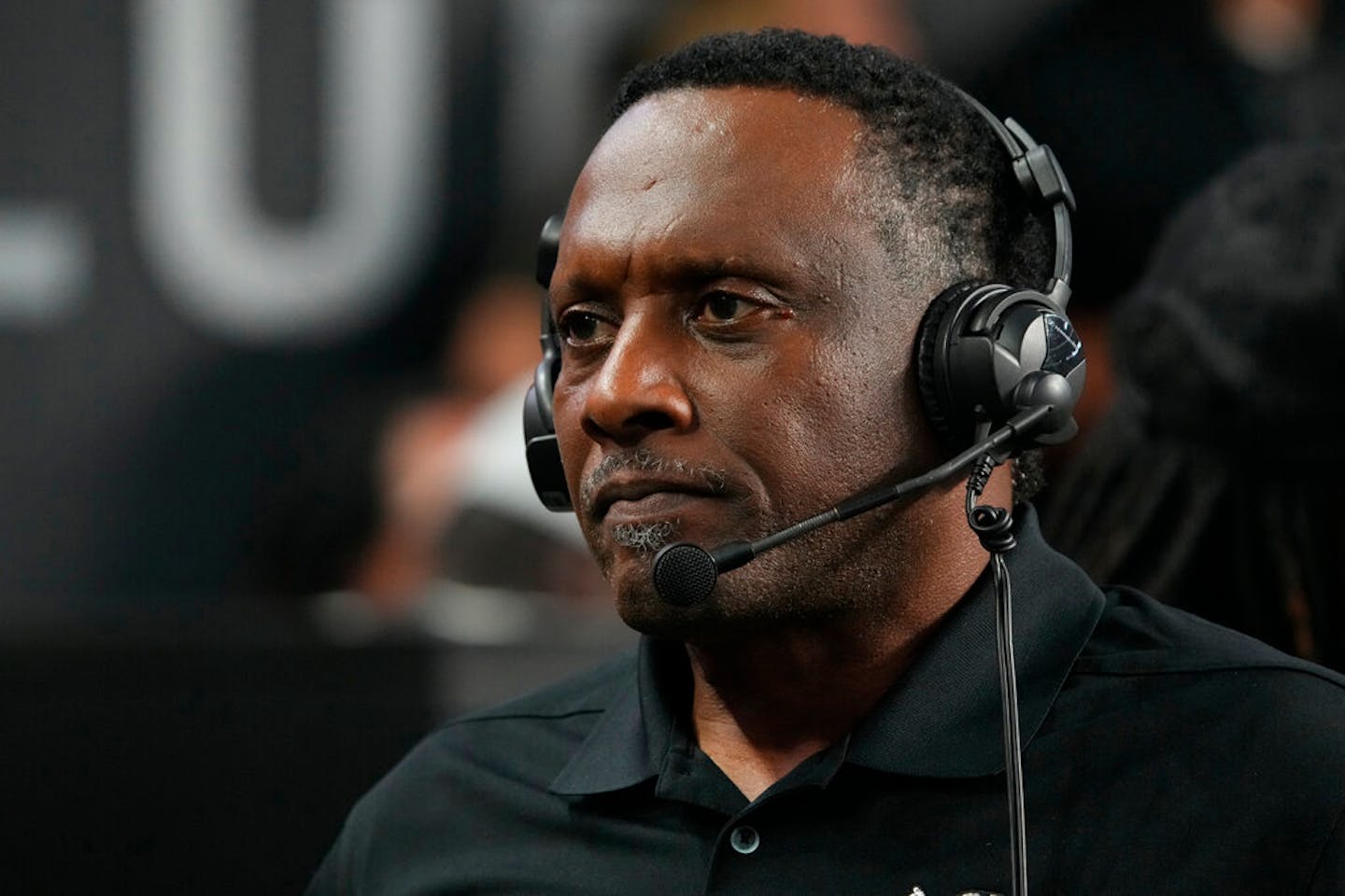 Las Vegas Raiders legend Tim Brown watches action against the New England Patriots during the first half of an NFL preseason football game, Friday, Aug. 26, 2022, in Las Vegas. (AP Photo/Rick Scuteri)