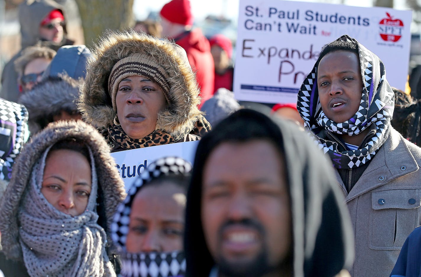 Parents stood alongside teachers to support the St. Paul teachers union as they gathered at the American Indian Magnet School for a rally, Wednesday, February 17, 2017 in St. Paul, MN.