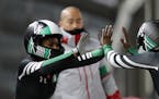 Driver Seun Adigun, right, and Akuoma Omeoga of Nigeria finish their second heat during the women's two-man bobsled competition at the 2018 Winter Oly