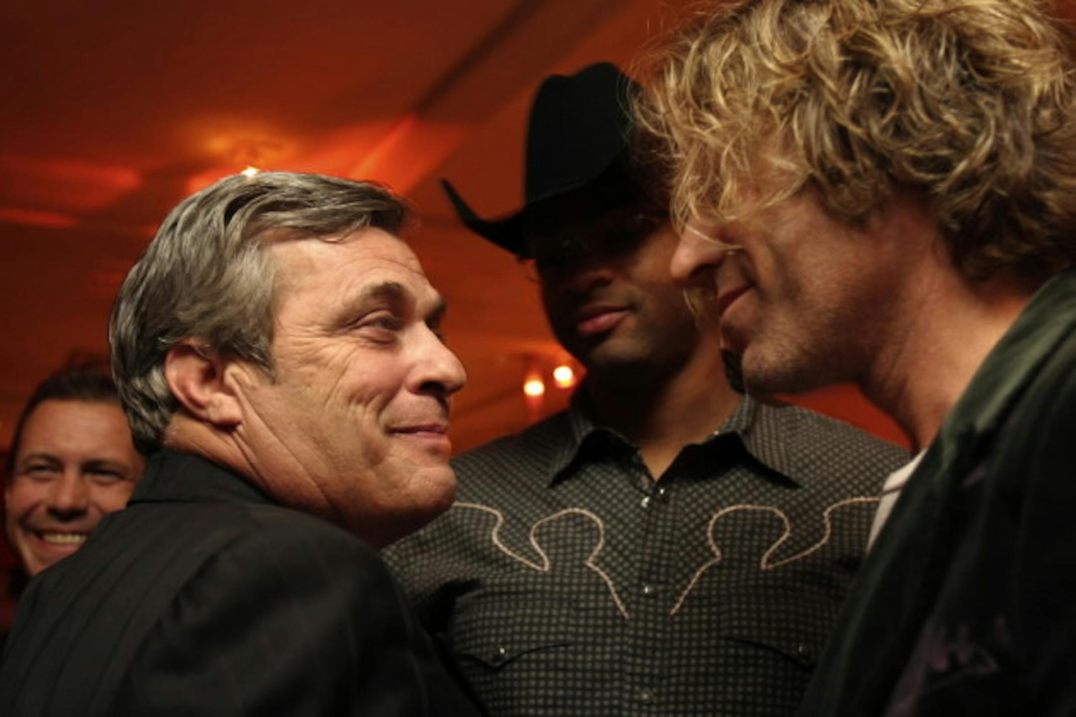 Mick Anselmo, left, chatted with Cowboy Troy and Big Kenny (Big & Rich) at the CMA Awards in 2005. / Star Tribune file