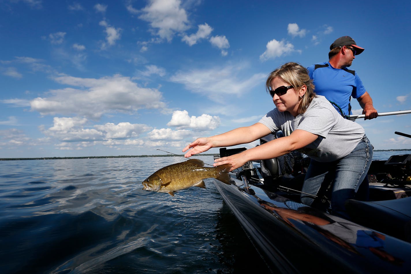 Suzy Anderson tossed back a small mouth bass into Lake Mille Lacs last July.