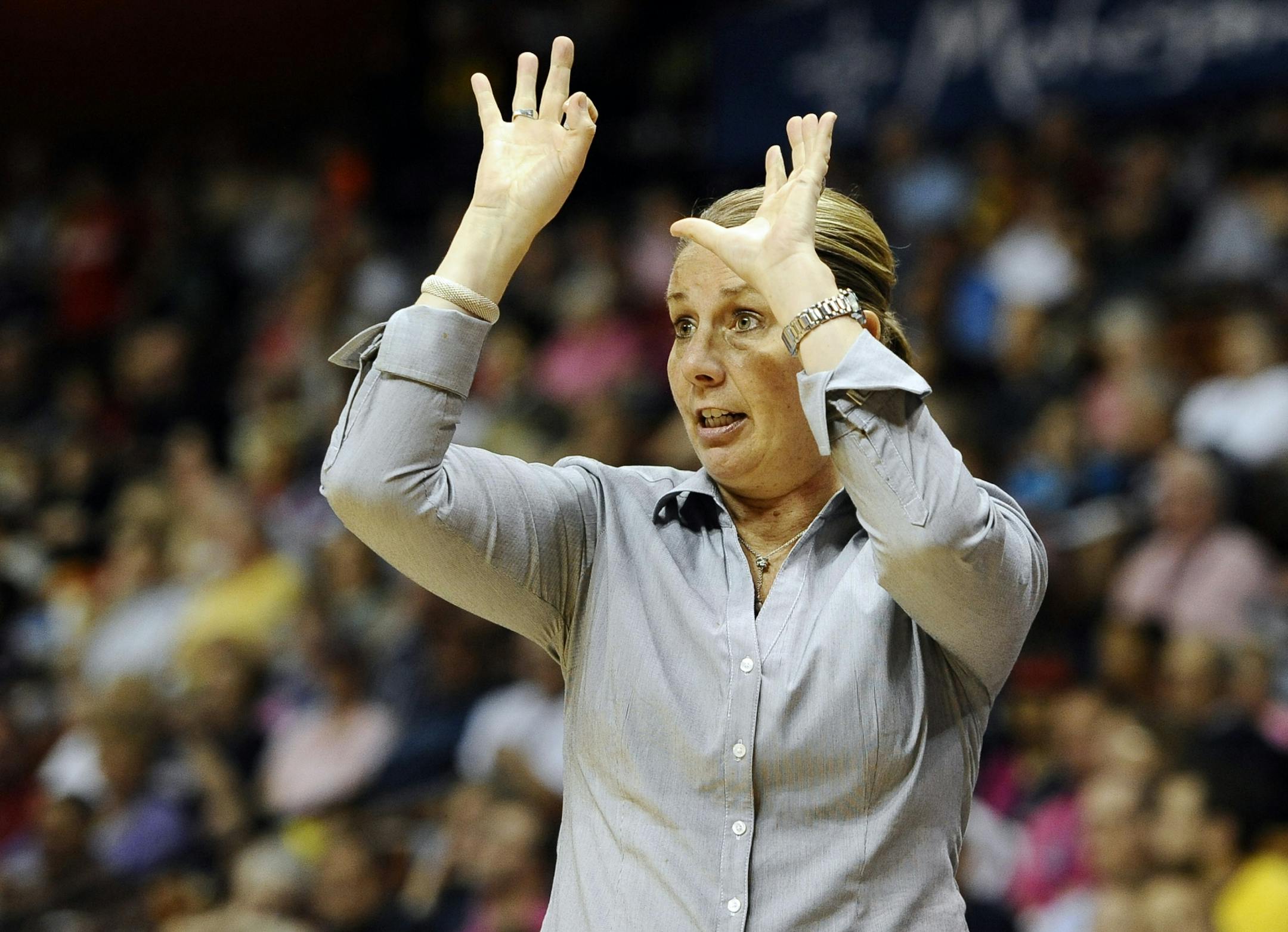Minnesota Lynx head coach Cheryl Reeve gestures during the first half of a WNBA basketball game against the Connecticut Sun, Sunday, July 27, 2014, in Uncasville, Conn.