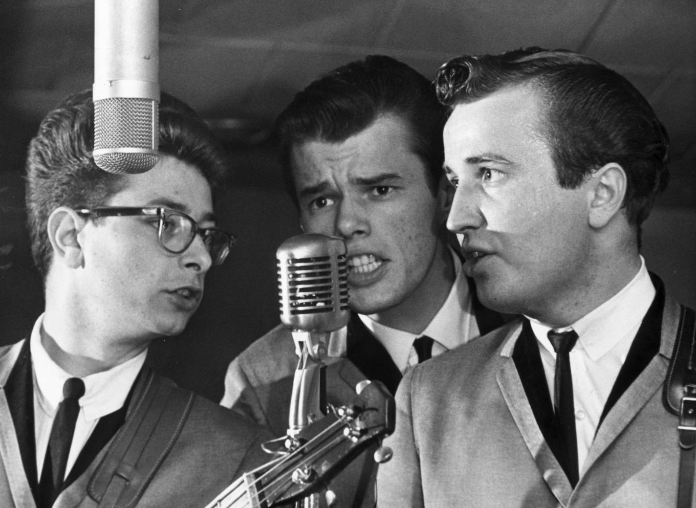 The three surviving Trashmen sharing a microphone circa 1964, photographed for a Minneapolis Tribune cover story that ran just as "Surfin' Bird" was taking off. From left: Bob Reed, Tony Andreason and Dal Winslow.