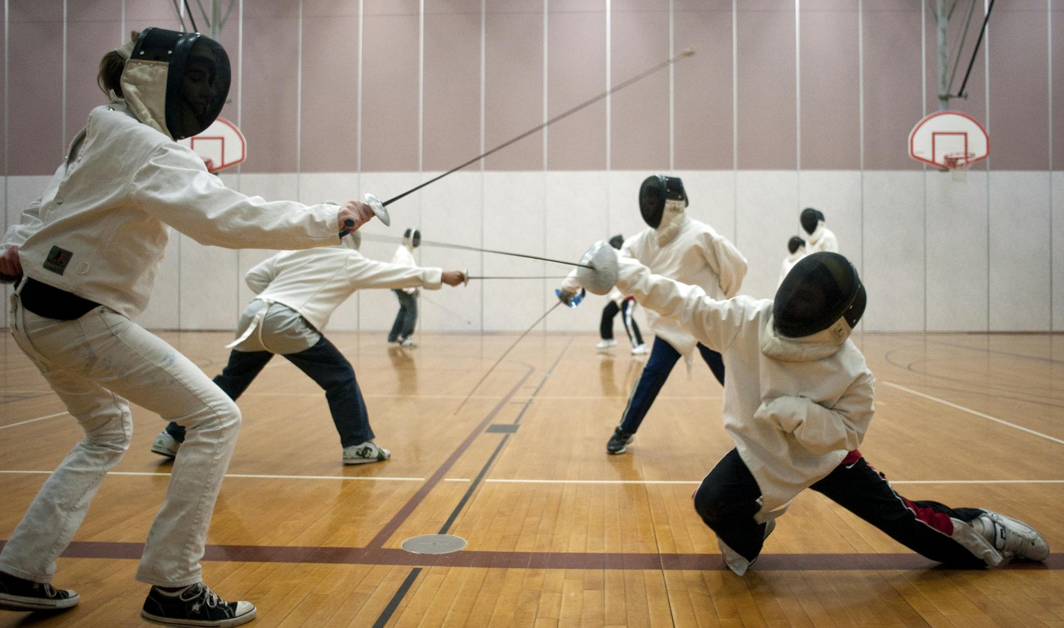 Jules Ameel / Star Tribune. Jules.Ameel@startribune.com. January 29 2011. Andover. Minn. In This Photo : ] Students practiced fencing on January 29th in Andover Minn. The Minnesota Sword Play teaches kids Olympic Fencing classes at several locations around the metro area.