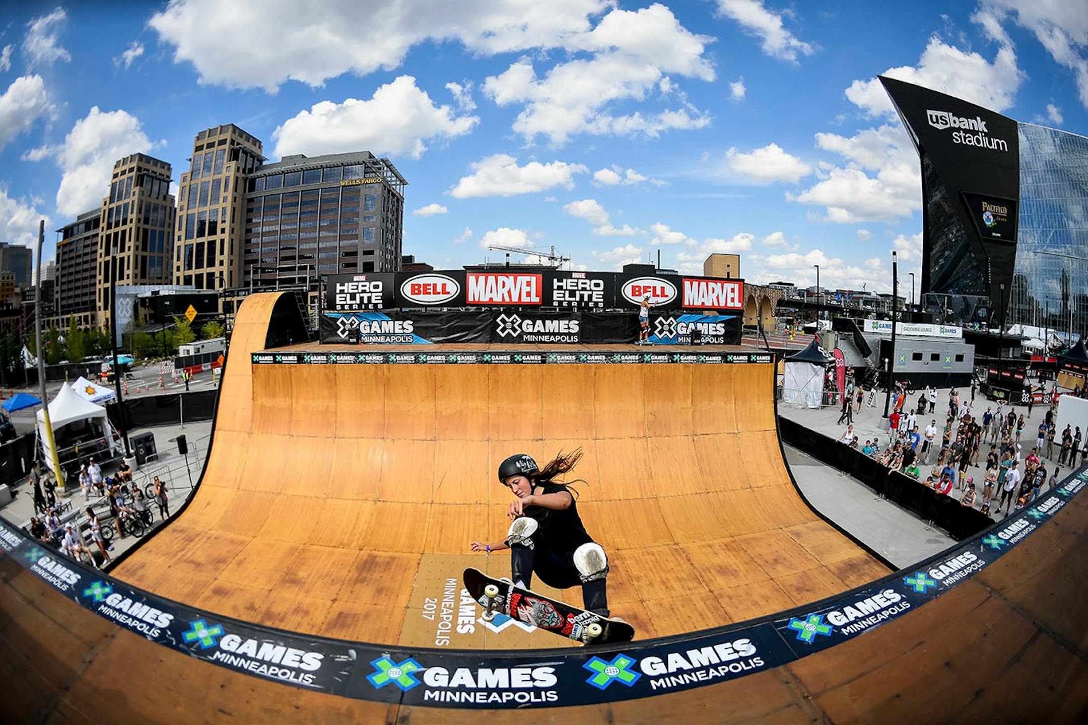 Nicole Hause, of Stillwater, performed a frontside grind on the vert ramp during a demo Sunday afternoon outside US Bank Stadium.